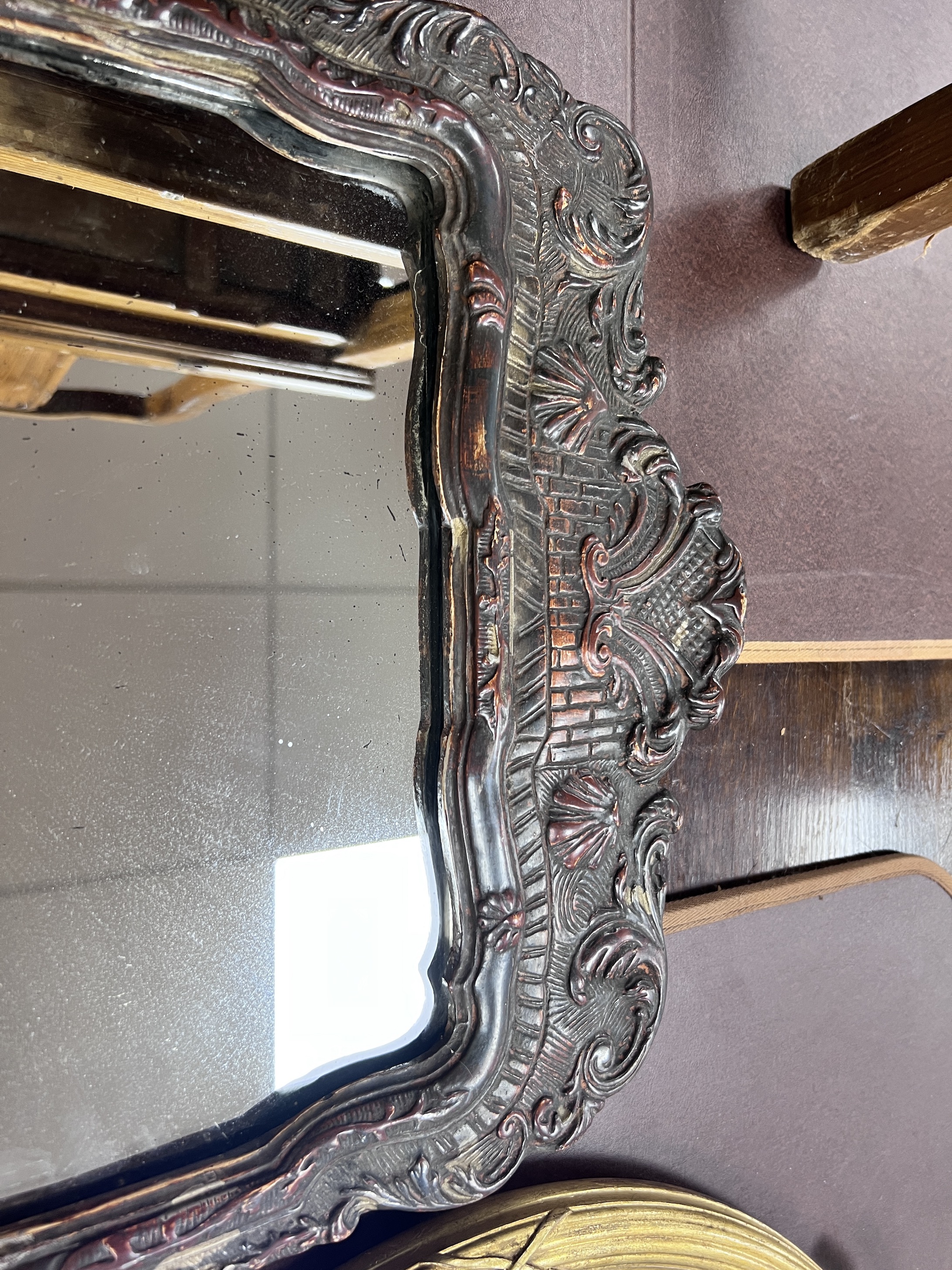 An early 18th century style carved and moulded wall mirror, width 39cm, height 61cm